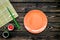 Japanese food cooking set with soy sauce, ginger, plate, bamboo sticks on wooden background top view copy space