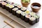 Japanese food mini maki sushi platter on white wooden table