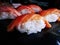 Japanese food Nigiri Sake salmon fish sushi close up on black dish