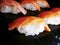 Japanese Food Nigiri Sake salmon sushi close up on a black dish