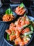 Japanese food salmon tataki spicy salmon salad with salmon sashimi fresh raw salmon meat and hotate kimuchi spicy boiled sca