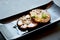 Japanese food style, Selective focus of sliced braised pork on black plate