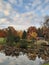 Japanese garden. Botanic garden, Moscow, Autumn.   Artificial pond, leaves in the water.