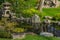 Japanese garden decorated with Japanese stone lanterns, flowers and stone floors