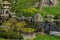 Japanese garden decorated with Japanese stone lanterns, flowers and stone floors