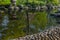 Japanese garden decorated with Japanese stone lanterns, flowers and stone floors