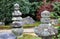 Japanese garden decorated stone cover by lichen moss and background the tree.