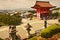 Japanese garden on a hill with a view of Kyoto in the background..Overview of the entrance gate of Kiyomizu-Dera Shrine in Kyoto