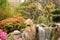 Japanese garden, its small waterfall and its flowers