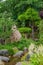 Japanese garden view with shaped .conifer trees, stones and pond in summer. Poland, Shklarska poreba.  Selective focus