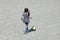 Japanese girl dribbling soccer ball