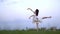 Japanese girl in white dress dancing ballet, slow motion