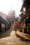 Japanese girl in Yukata with red umbrella in old town Kyoto