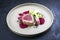 Japanese gourmet fried tuna fish steak tataki with pak choi, witloof and red beet on a modern design plate
