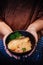 Japanese grilled snow fish donburi rice bowl in waitress hands i