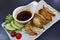 Japanese gyoza with sauce and salad