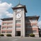 Japanese high school facade building with time clock in traditional classic style