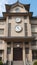 Japanese high school facade building with time clock in traditional classic style