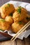 Japanese hot potato korokke or croquettes in breadcrumbs closeup