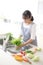 Japanese housewife washing vegetables