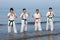 Japanese karate boys and girls at the beach