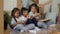 Japanese Kids Eating Pizza While Mother Packing Moving Boxes Indoor