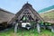 Japanese lake and boat roof of thatch.