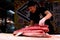 Japanese man cutting giant tuna