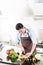 Japanese man preparing salad and cooking