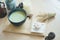 Japanese matcha green tea. A Japanese matcha green tea with soft focus on the bamboo whisk. served with a cute teddy bear macaron