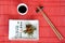 Japanese meals on red mat with sticks