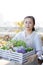 Japanese middle-aged woman enjoys flower seedling planting terrace