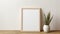 Japanese Minimalism: Empty White Frame With Plant On Table