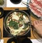 Japanese nabemono hotpot dish of thinly sliced meat and vegetable boiled in water served with dipping sauces, also known as Shabu