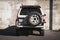 Japanese offroad used white car Toyota Hilux Surf, rear view
