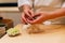 Japanese Omakase Chef making Chutoro Sushi Medium Fatty Bluefin Tuna, pasting fresh wasabi neatly by hands.