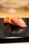 Japanese Omakase in Edo Style: Close up Otoro Fatty Tuna Sushi served on glossy black plate. Japanese traditional luxury meal