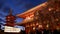 Japanese Pagoda and hozomon gate at senso-ji shrine in Tokyo during sunset.