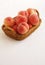 Japanese peach in wooden basket