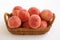 Japanese peach in wooden basket