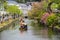 Japanese people on the river channel and cherry blossoms, Kurashiki, Japan