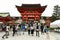 Japanese people and tourists enter Fushimi Inari Shrine