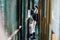 Japanese people waiting in line at a batting cage