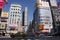 Japanese people waiting traffic signs for walk crossover traffic road with cityscape at Shinjuku