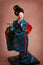 Japanese porcelain doll in blue kimono