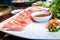 Japanese pork served on a plate decorated with flowers and mouthwatering fresh wasabi.