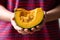 Japanese pumpkin or Kabocha holding by hand