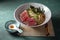 Japanese ramen. Asian soup with noodles ramen, miso, fried tuna steak and seaweed algae