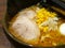 Japanese Ramen with pork slices, corns in thick broth. It consists of Chinese-style wheat noodles served in a meat or fish-based