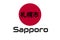 Japanese red circle rising sun sign from japan national flag with inscription of city name: Sapporo on english and